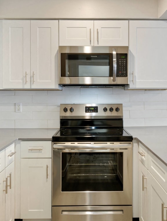 a kitchen with stainless steel appliances and a sink