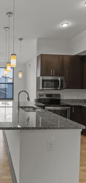 a kitchen with a counter top and a sink