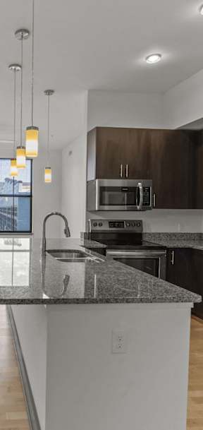 a kitchen with a counter top and a sink