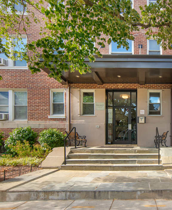 Front Entrance to The Rocksboro, flagstone steps and glass door with intercom