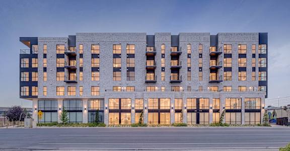 A modern building with a lot of windows and balconies.