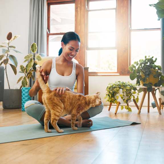 a woman walking on a treadmill with her shoes on