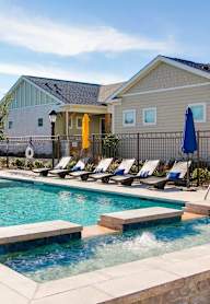 A sunny day at the pool with a clear blue sky.