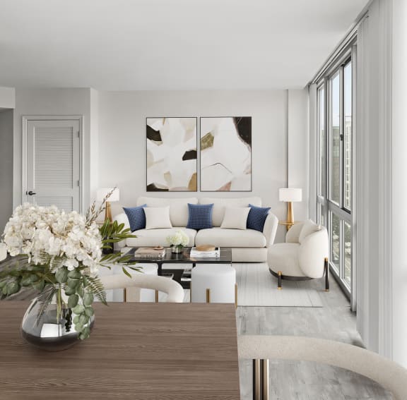 a living room with a large window and a wooden table