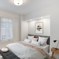 a bedroom with a large bed and a large window