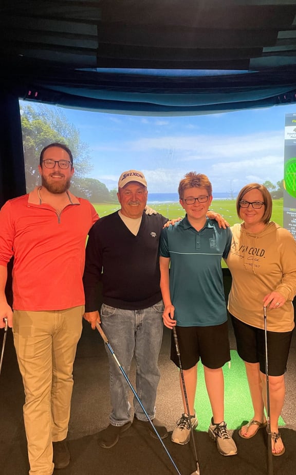 a group of people posing for a picture with golf clubs at Vue at Bluestone, Duluth, 55803