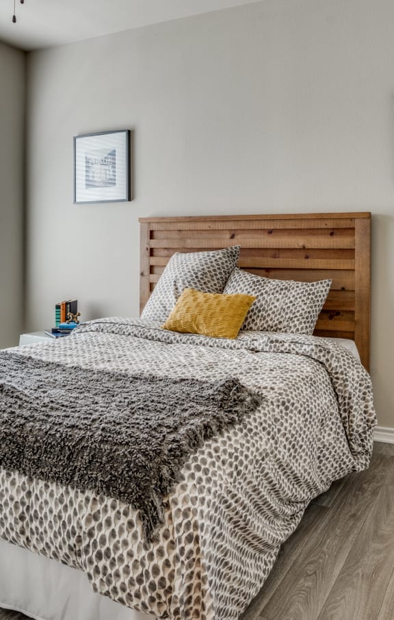 a bedroom with a bed and a ceiling fan