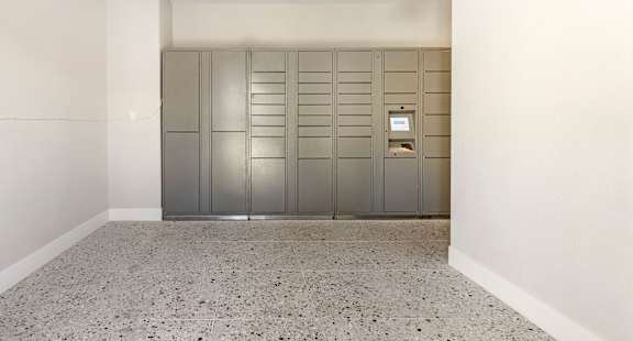 Our well-lit and spacious hallway leading to the parcel lockers offers easy, convenient access for all residents.