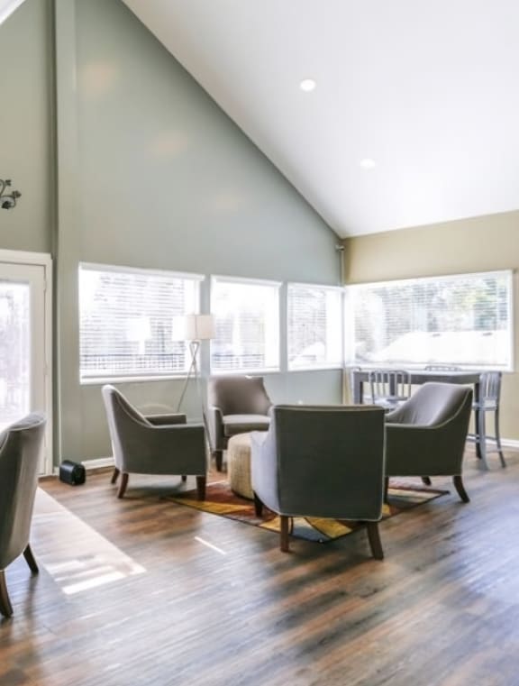 a kitchen with an island and red bar stools