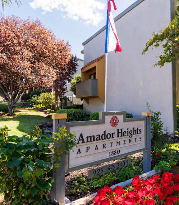 A sign for Amador Heights is in front of a building.