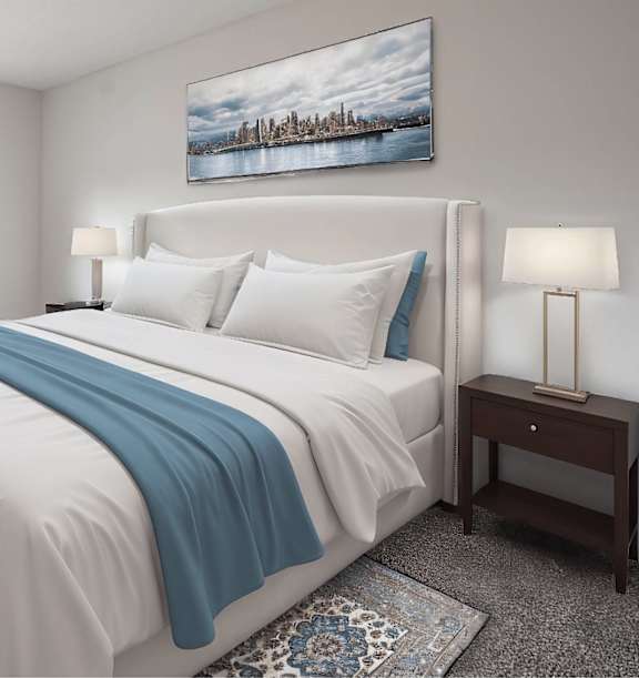 A bedroom with a bed, a nightstand, a window, and a plant.