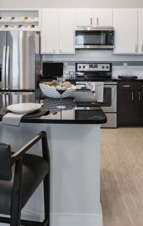 a kitchen and dining area in a 555 waverly unit