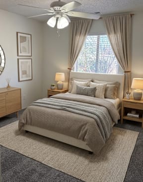Bedroom layout with bed, ceiling fan, and window at Muirfield Apartments (furniture not included).