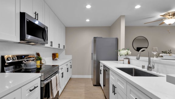 kitchen in a bedroom plus den unit.