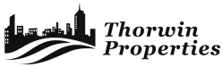 The image is a logo for Thorwin Properties, featuring a city skyline and waves.
