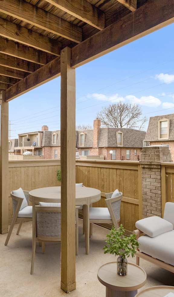 a patio with a couch and a table
