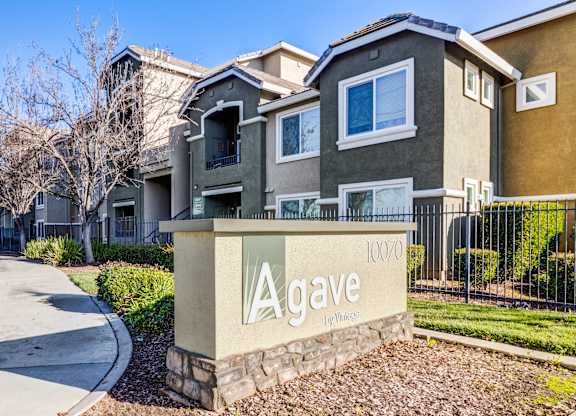 A gated community with a sign that says Agave.