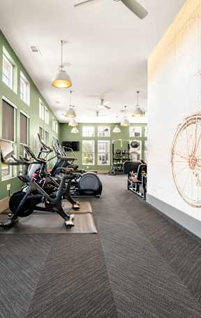 A room with a green wall and a bicycle diagram on the wall.