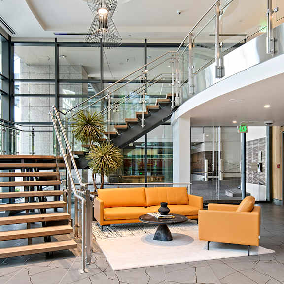 A modern interior with a staircase and a television.