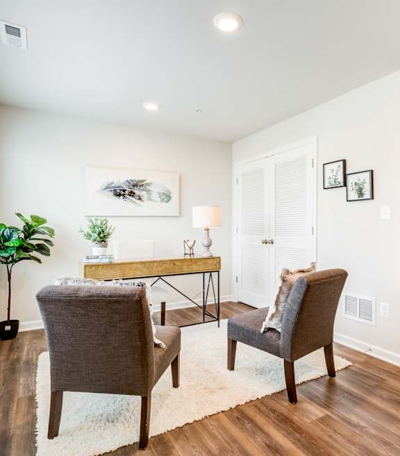 Living Room with Two Brown Chairs at Refinery Row in Baltimore, MD 21224