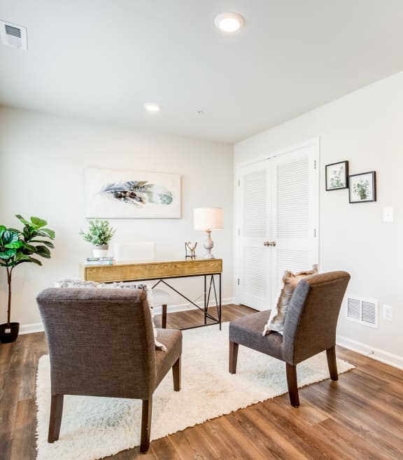 Living Room with Two Brown Chairs at Refinery Row in Baltimore, 21224