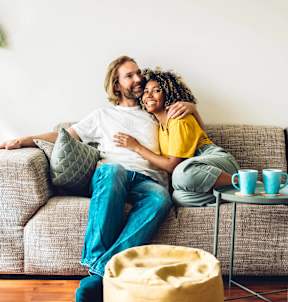 a man and a woman sitting on a couch
