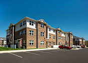 Thumbnail 36 of 36 - Apartment complex with onsite parking lot