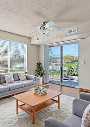 A kitchen with a sink and a refrigeratorat Melbourne Apartments, Iowa, 50320
