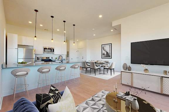A modern living room with a bar area and a television.