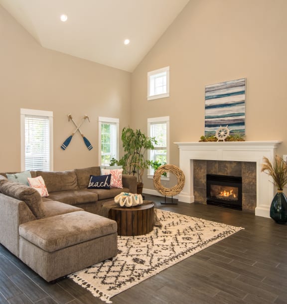 Stillwater apartments clubhouse seating area and fireplace 