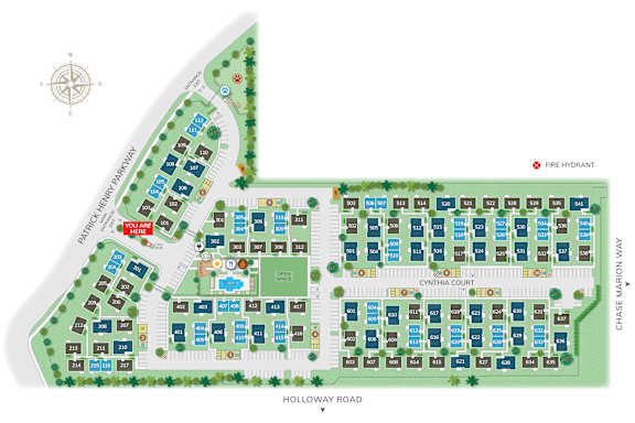 A map of a neighborhood with a compass rose in the upper left corner and a red marker indicating "you are here."