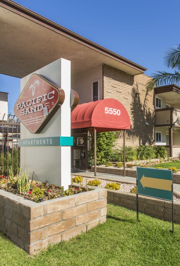 Pacific Sands entrance with tropical landscaping