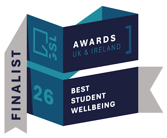 A graphic design of a book with the words "Finalist" and "Awards UK & Ireland" on the left page, and "Best Student Wellbeing" on the right page.