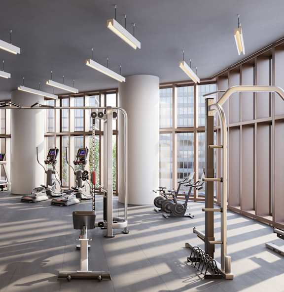A modern living room with a large window and a gym in the background.