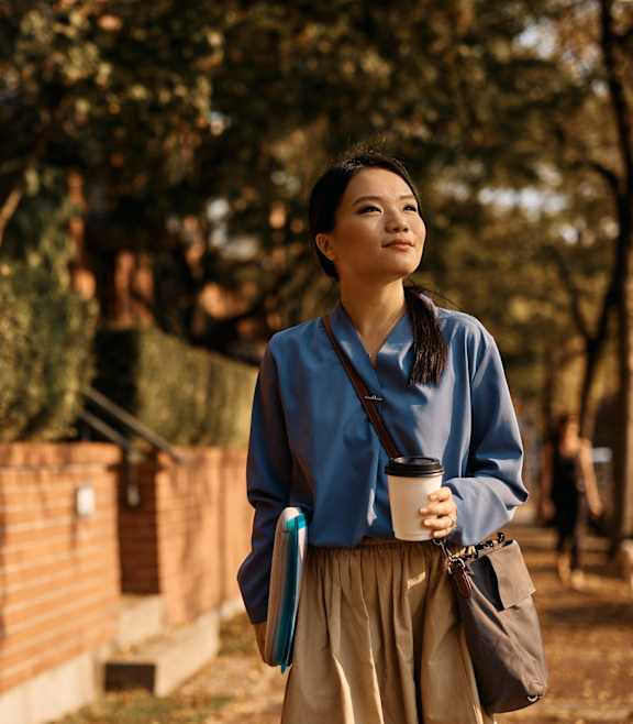 Woman With Coffee Cup at Terraces at Town Center, Jacksonville