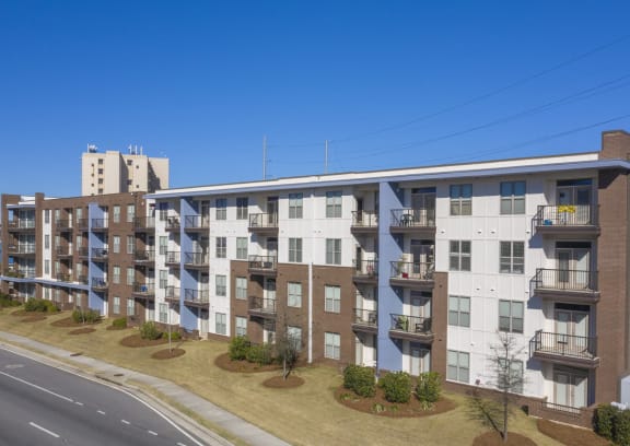 a large apartment building on the side of a street at Canalside, Augusta, GA