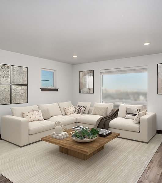 A living room with a white couch, a coffee table, and a painting on the wall.