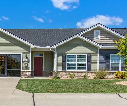 a house with a large driveway in front of it