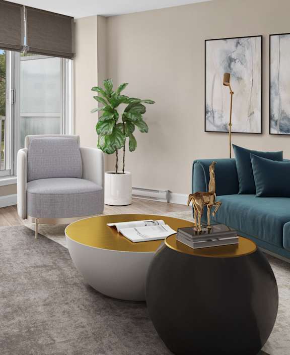 A living room with a white couch and a dining table.