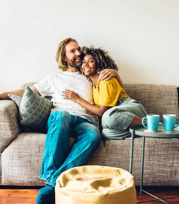 a man and a woman sitting on a couch