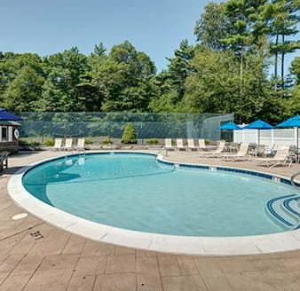 Community Swimming Pool with Lounge Chairs at Mariner's Hill Apartments, Marshfield