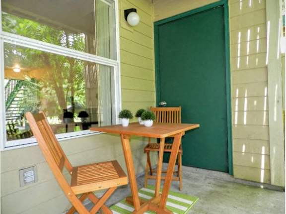Wooden chair and bench at Commons at Creekside Apartments, Oregon