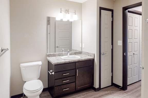 Renovated bathroom with linen storage closet at Northridge Heights Apartments