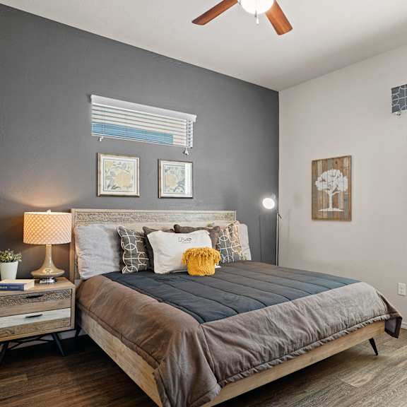 a bedroom with a bed and a ceiling fan at Bella Grace, Chandler, AZ