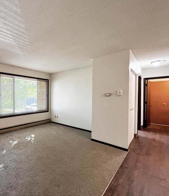 a living room with a couch and a chair and a table