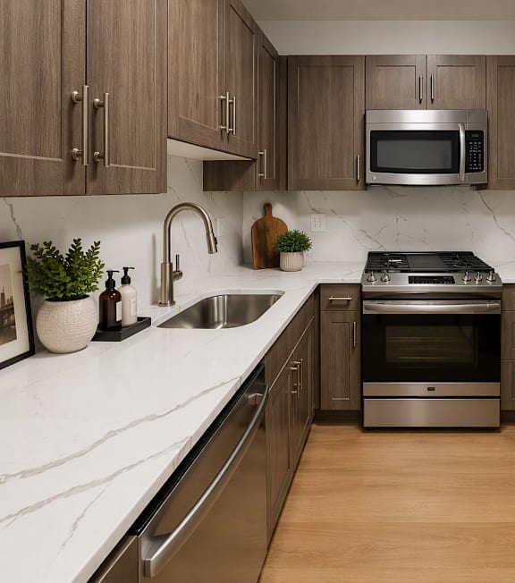 A kitchen with wooden cabinets and stainless steel appliances.