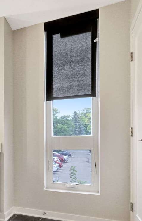 a bathroom with a toilet and a sink and a window