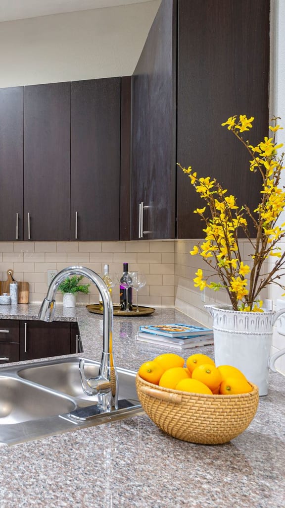 a kitchen with stainless steel appliances and granite counter tops