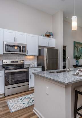 spacious bedrooms at the district flats apartments in lenexa at Lofts at Zebulon, Macon, GA