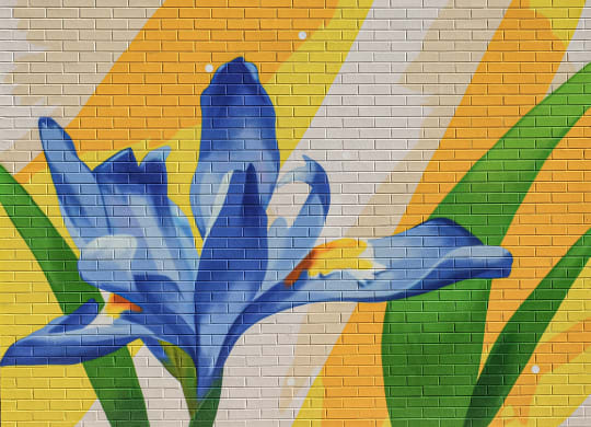a mosaic of a flower on a brick wall